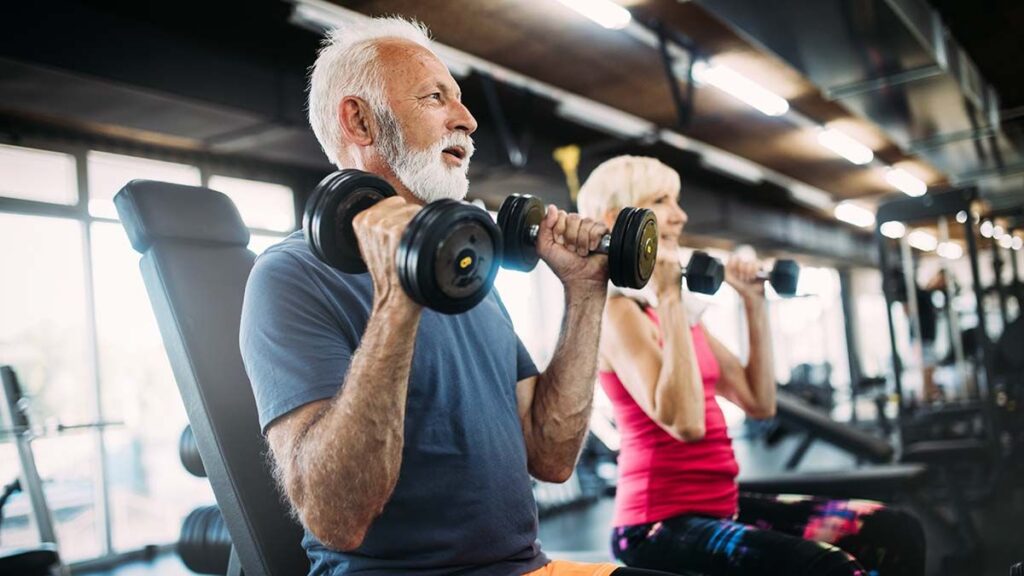 happy,senior,people,doing,exercises,in,gym,to,stay,fit